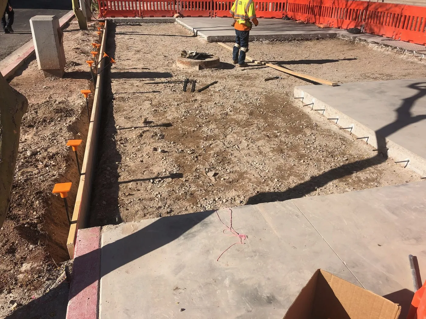 Forming and rebar set for a slab pour, with barricades holding the work area