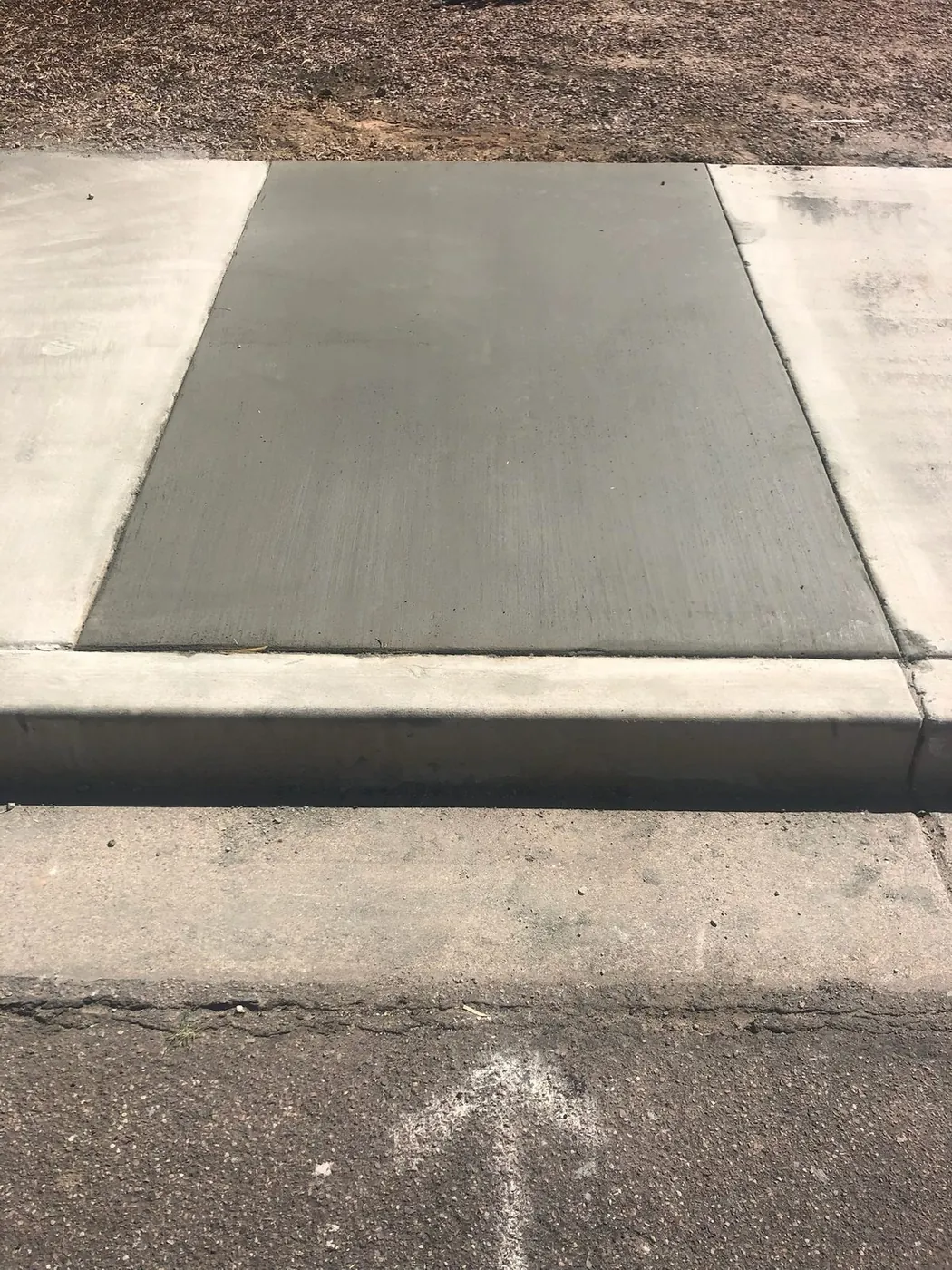 Replacement panel poured flush into an existing walkway