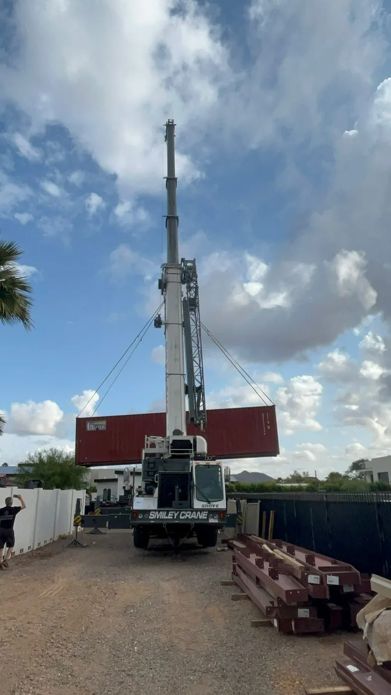 Mobile crane rigged for a shipping container lift
