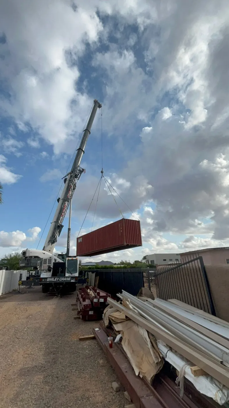 Container under the hook, swung out over the staging area