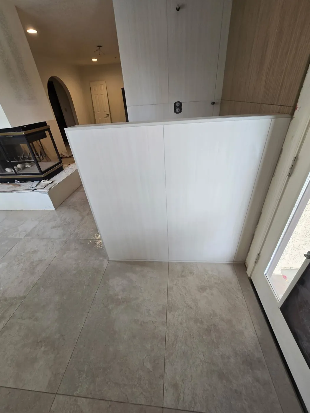 Tiled partition wall and flooring during an interior renovation