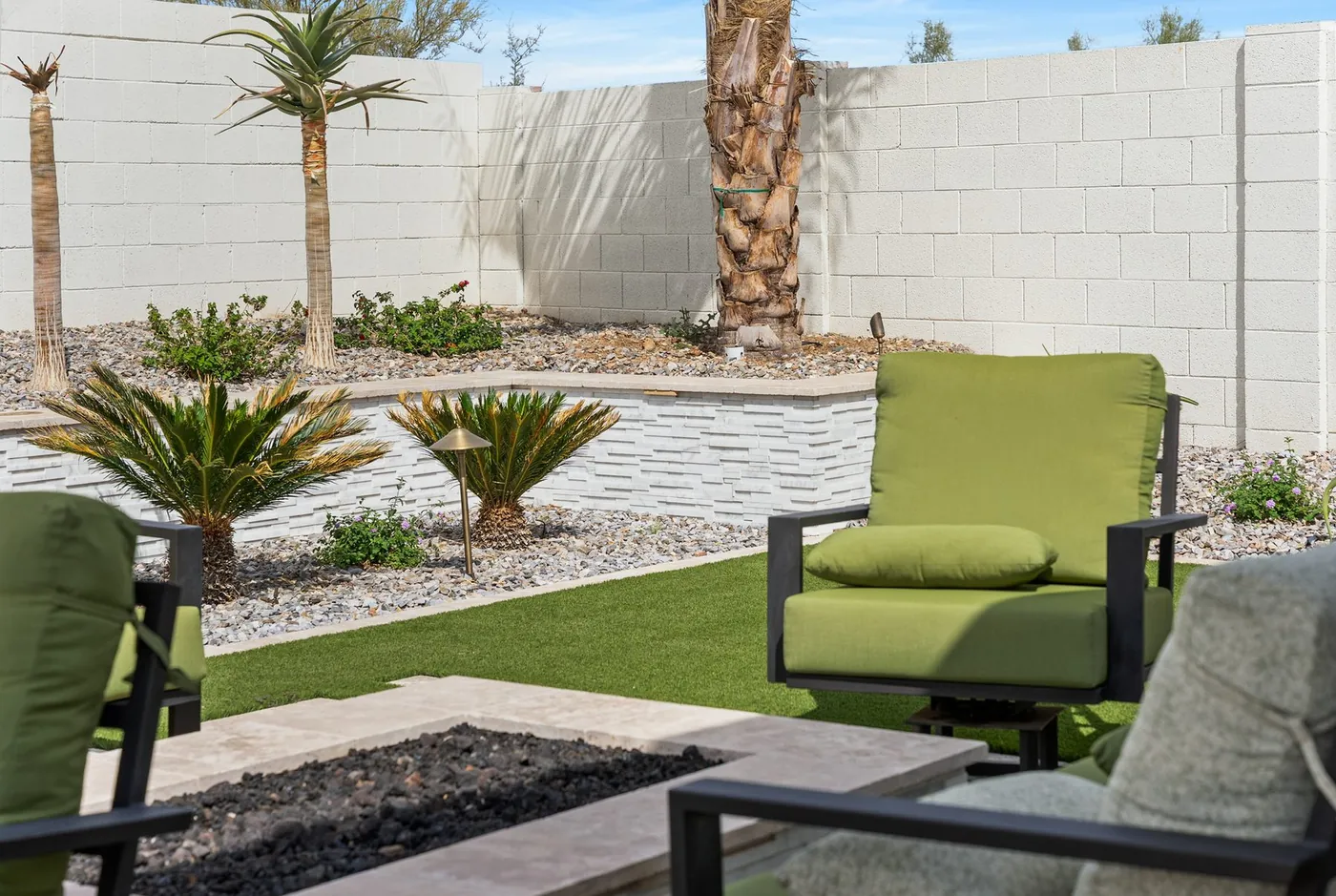 Fire feature and seating set against the planted border