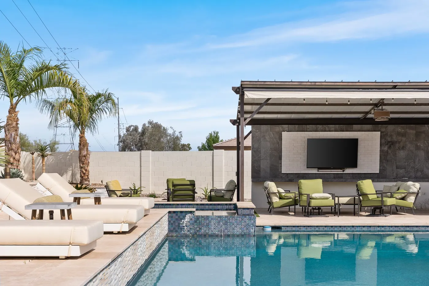 Baja shelf and in-pool loungers under the ramada