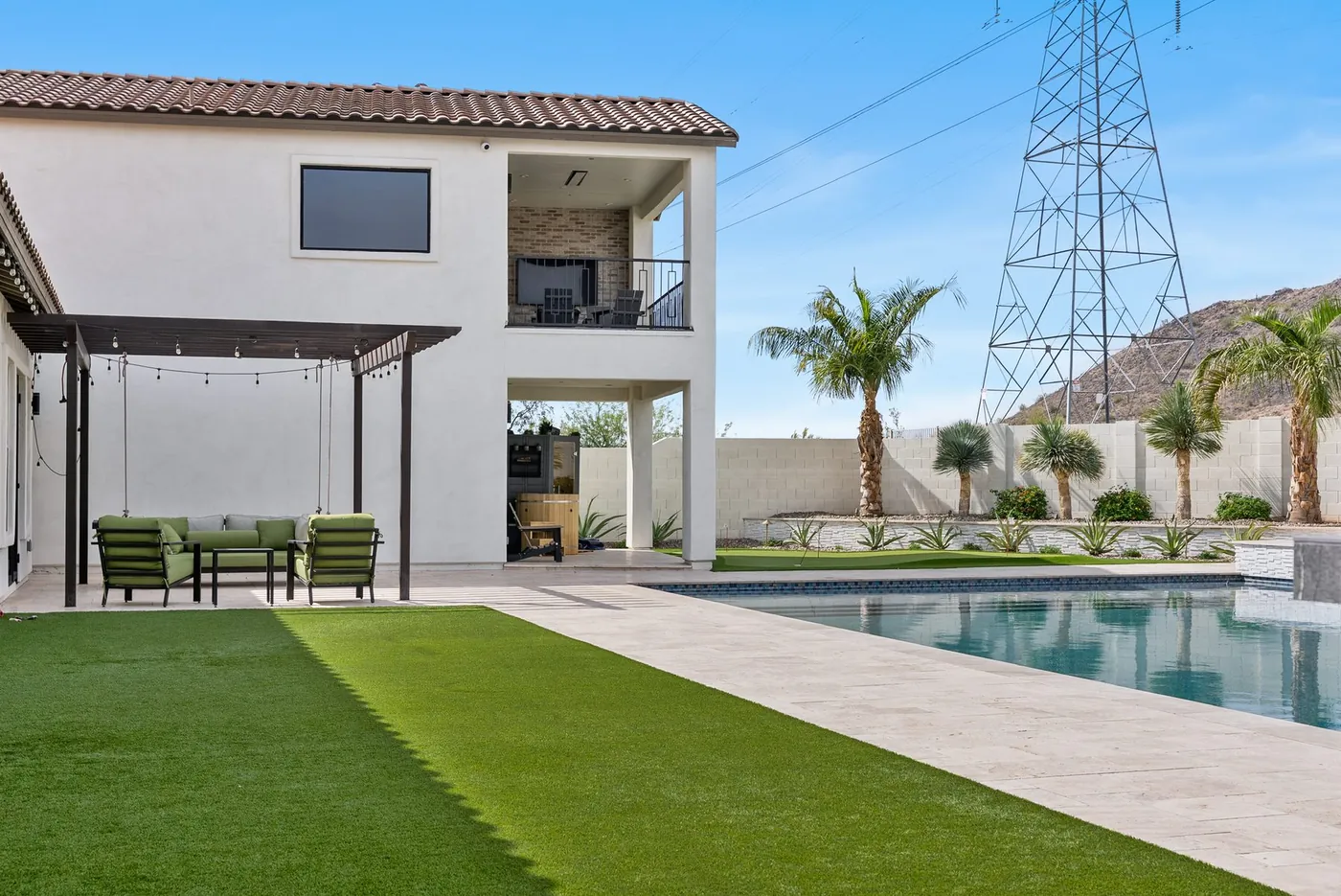 Turf run and pergola alongside the pool