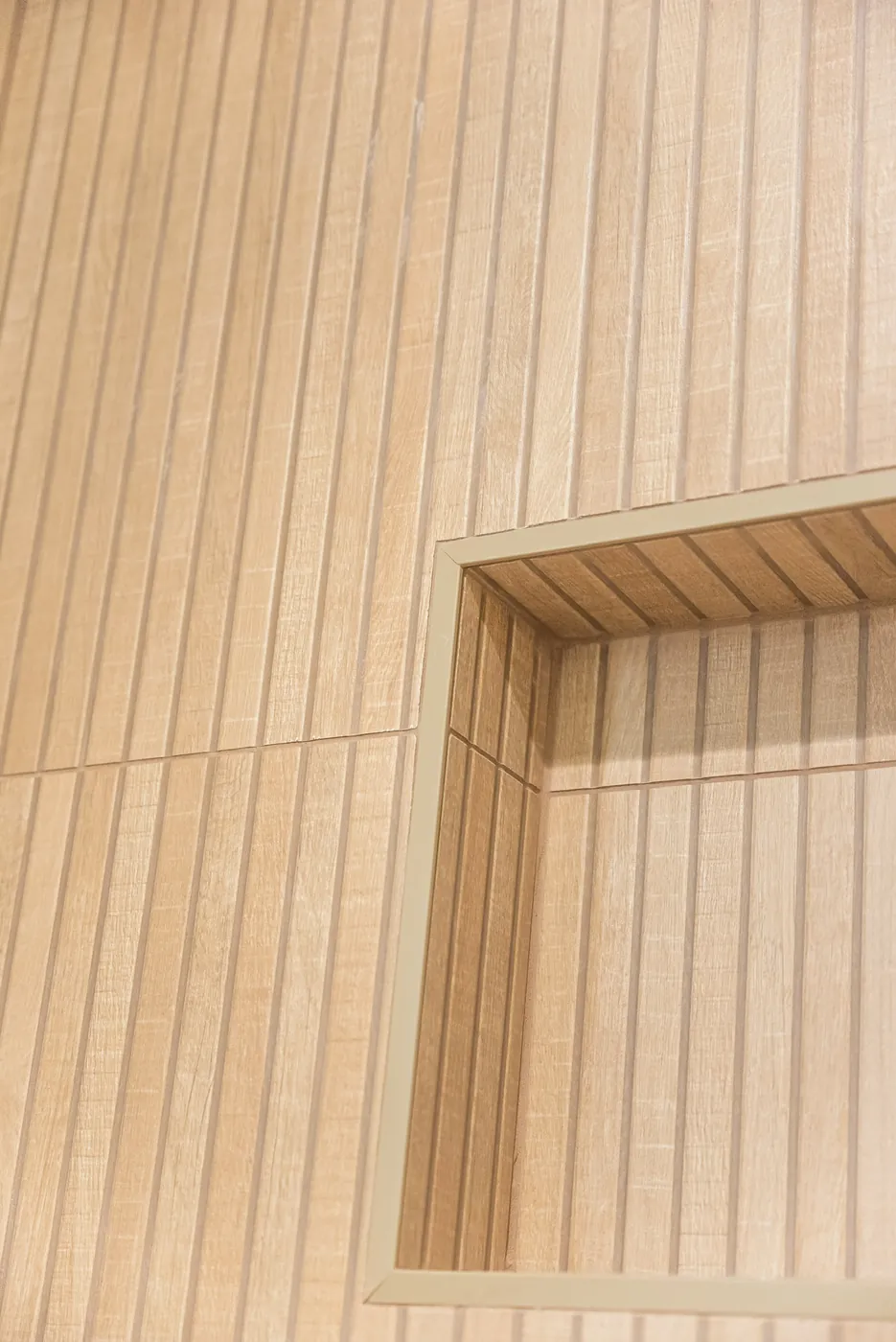 Niche set straight into the fluted tile wall