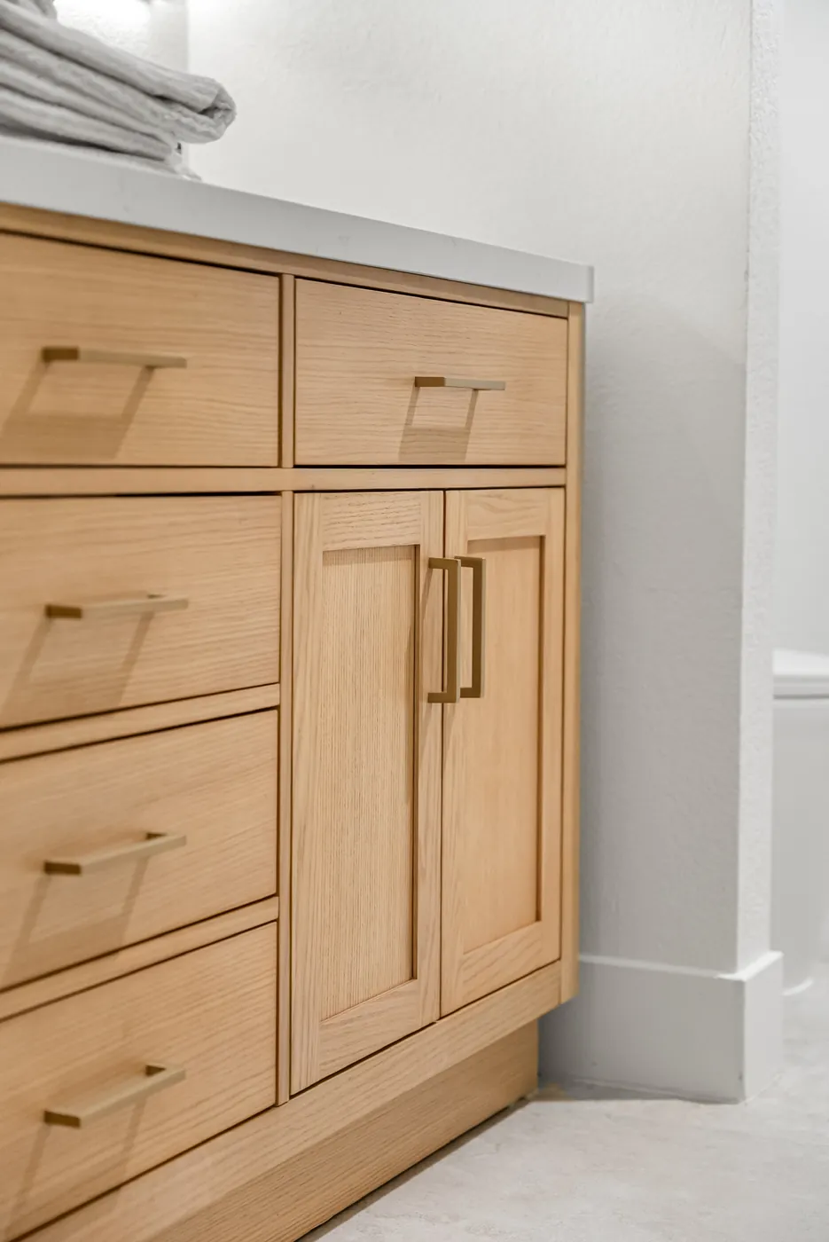 Drawer fronts and pulls on the vanity cabinet