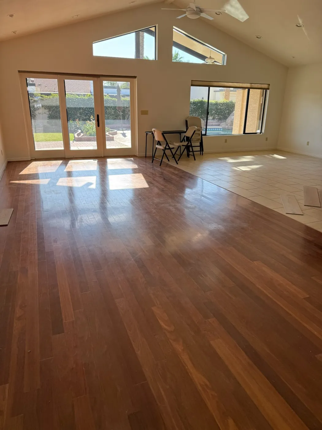 Great room after renovation, with new hardwood under the vaulted ceiling