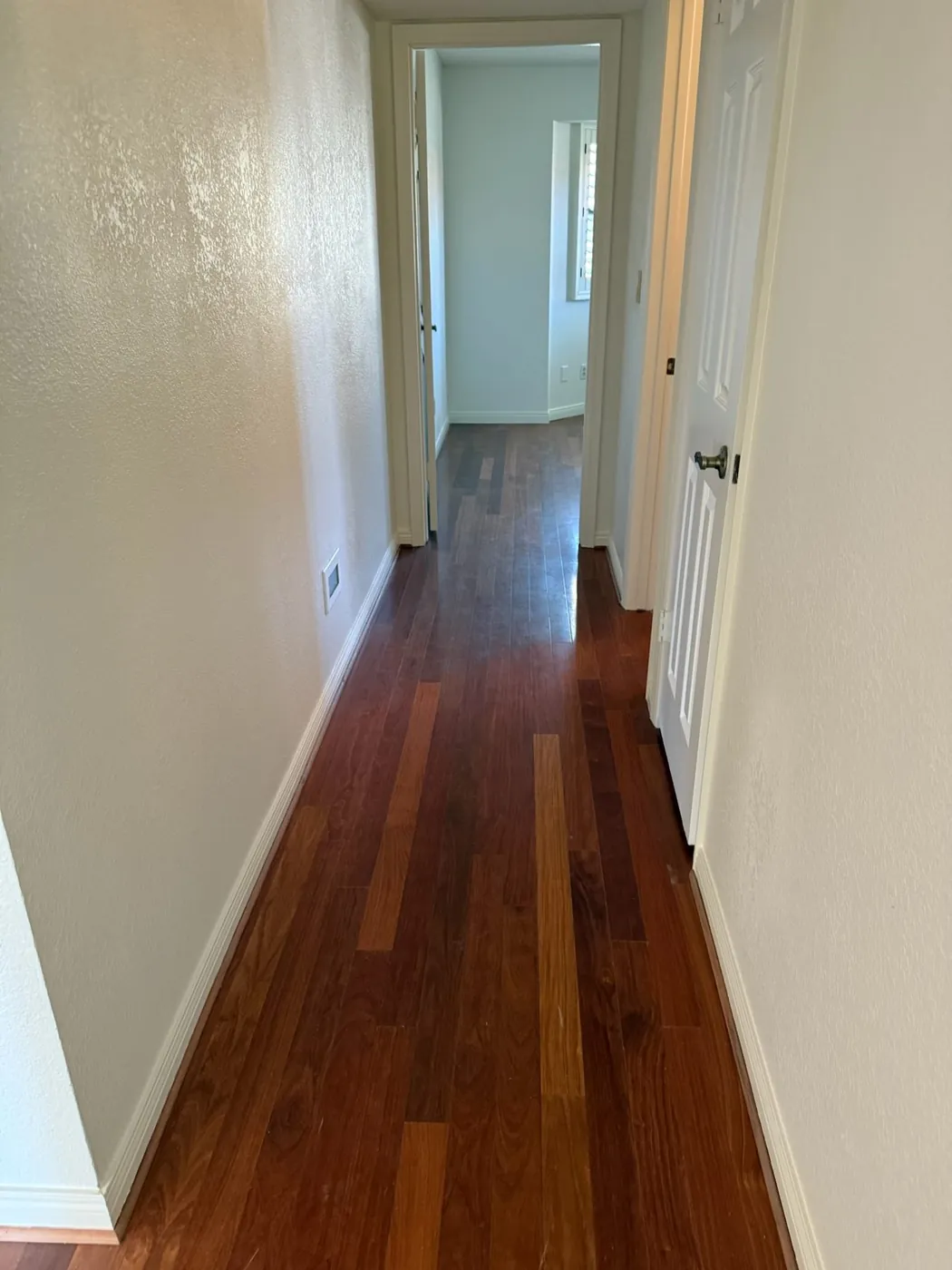 Hallway with hardwood run through to the bedrooms