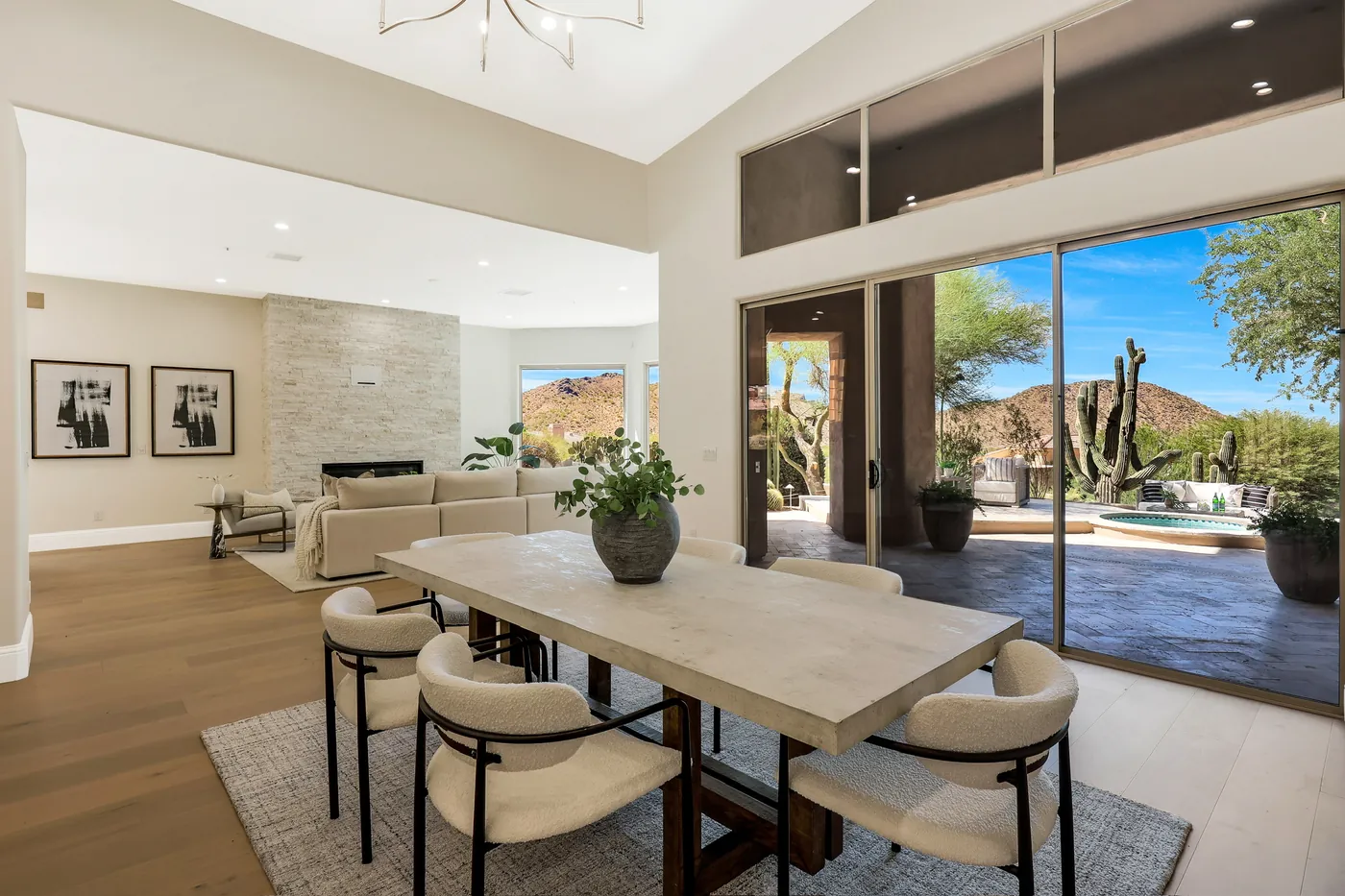 Dining area beside sliding doors that open to the patio and desert