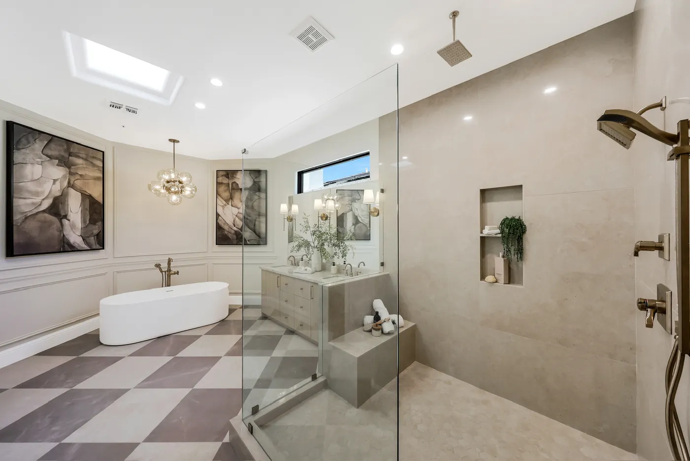 Glass shower with a tiled bench and niche, the tub in the foreground