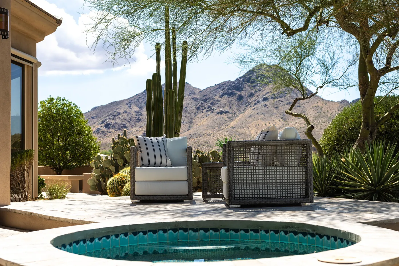 Spa and outdoor chairs against the desert and mountain